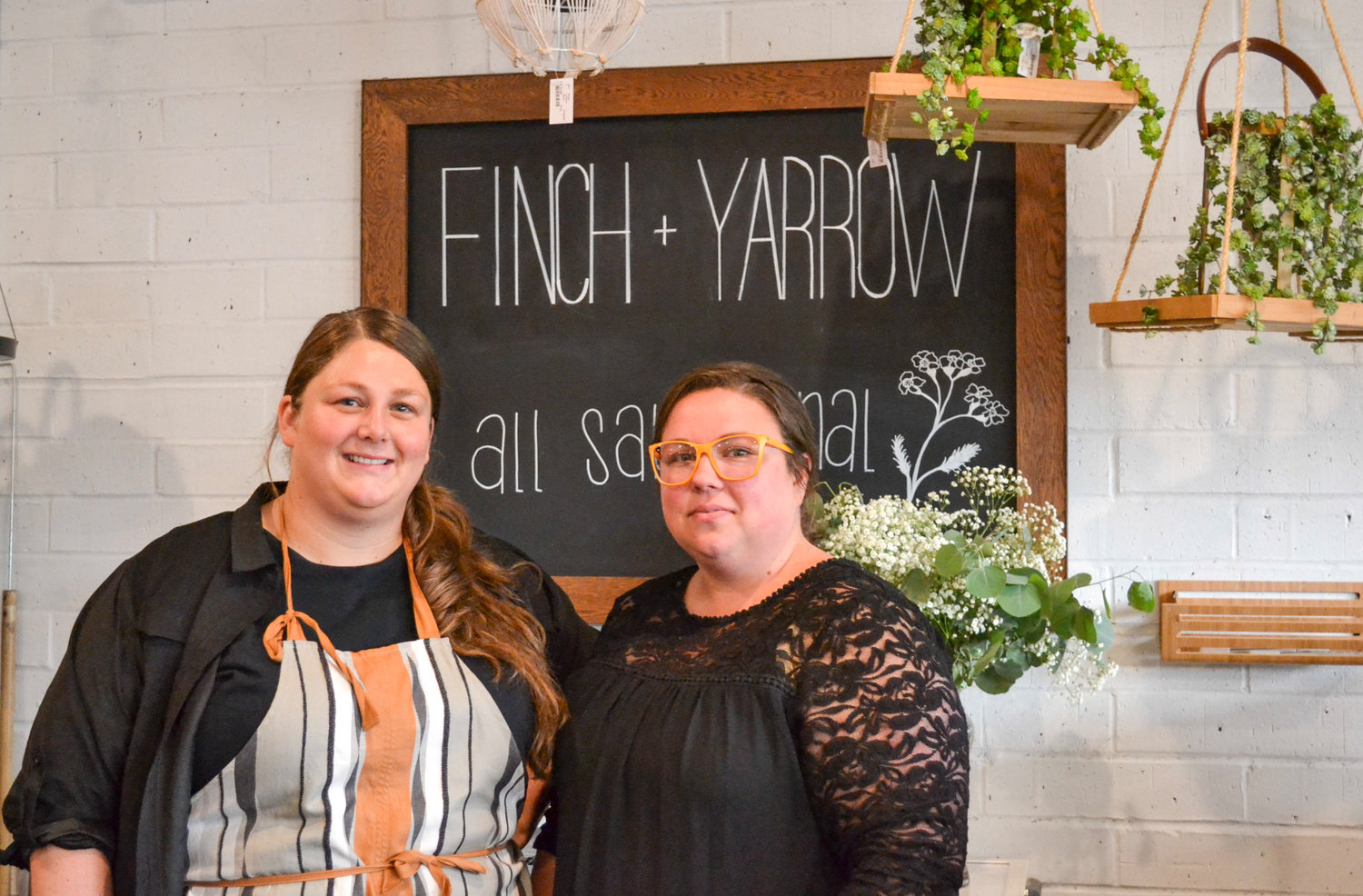 Amboy residents Megan Helmers, left, and Maggie Bellikka opened Finch + Yarrow to provide their local area more options for shopping.